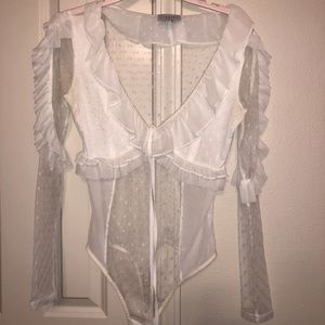 LIONESS white sheer bodysuit.